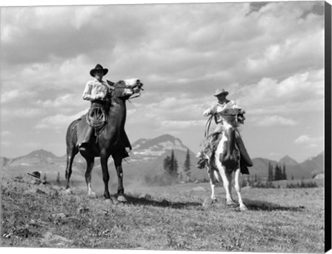 Framed Pair Of Cowboys On Horseback At Glacier Fifty Mountain Camp Print