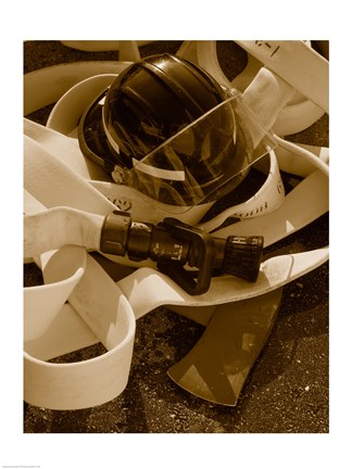 Framed Close-up of a firefighter&#39;s helmet on a fire hose Print