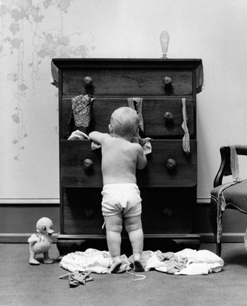 Framed 1940s Toddler Baby Pulling Clothes Out Of Bureau Print