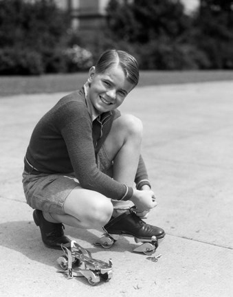 Framed 1930s Smiling Boy Fastening On Metal Roller Skates Print