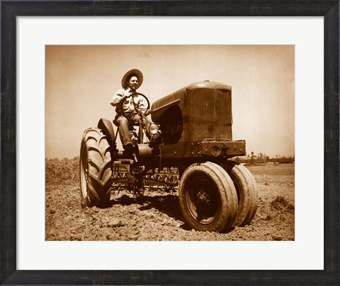 Framed Farmer Plowing a Field with a Tractor Print