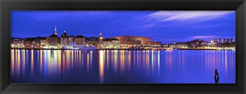 Framed Buildings at the waterfront lit up at dusk, Stockholm, Sweden Print