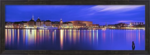Framed Buildings at the waterfront lit up at dusk, Stockholm, Sweden Print