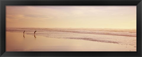 Framed Two children playing on the beach, San Francisco, California, USA Print