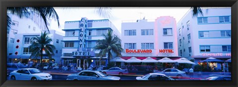 Framed Traffic on road in front of hotels, Ocean Drive, Miami, Florida, USA Print