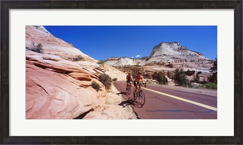 Framed Two people cycling on the road, Zion National Park, Utah, USA Print
