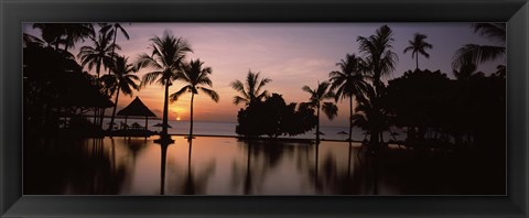 Framed Sunset over hotel pool, Lombok, West Nusa Tenggara, Indonesia Print