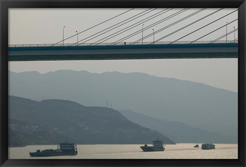 Framed Container ships passing a newly constructed bridge on the Yangtze River, Wanzhou, Chongqing Province, China Print