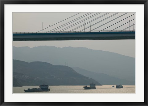 Framed Container ships passing a newly constructed bridge on the Yangtze River, Wanzhou, Chongqing Province, China Print