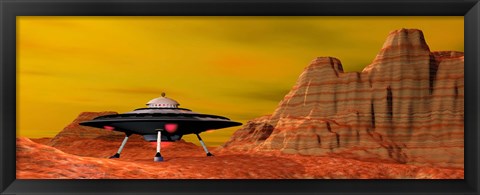 Framed UFO landing on a desert landscape Print