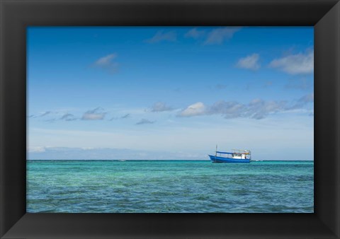 Framed Fishing boat in the turquoise waters of the blue lagoon, Yasawa, Fiji, South Pacific Print