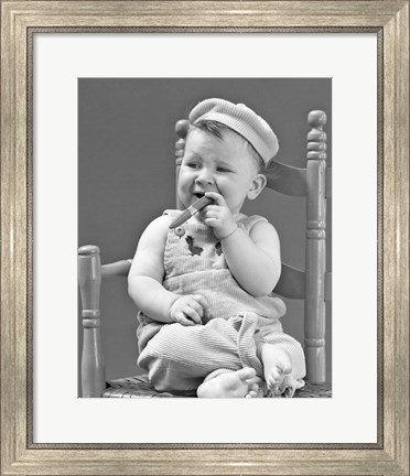 Framed 1940s Baby Sitting Chair Holding Cigar Print