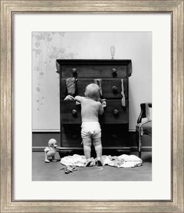 Framed 1940s Toddler Baby Pulling Clothes Out Of Bureau Print