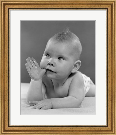 Framed 1950s Baby Lying On Stomach With Thumb In Mouth Print
