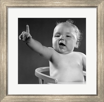 Framed 1940s 1950s Baby Sitting In Chair Arm And One Finger Raised Print