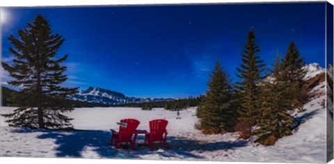 Framed Red Chairs Under a Moonlit Winter Sky at Two Jack Lake Print