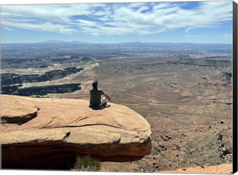 Framed Adult Male Sitting on the Edge Of a Stunning Viewpoint Print