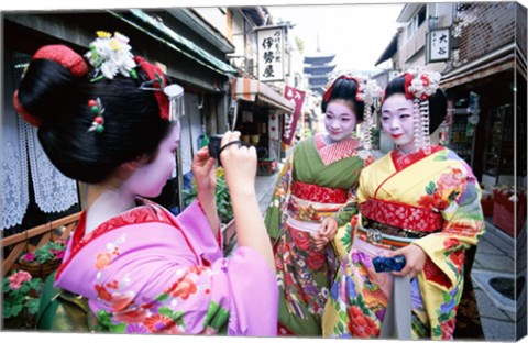 Framed Three geishas, Kyoto, Honshu, Japan (taking pictures) Print