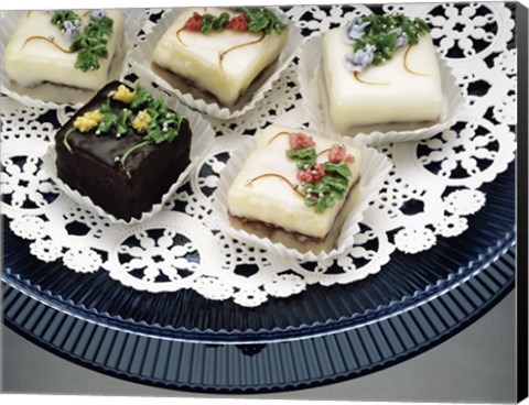 Framed Close-up of assorted cakes on a plate Print