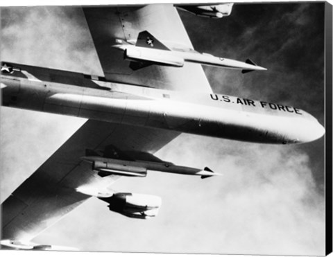 Framed Low angle view of a bomber plane carrying missiles during fight, AGM-28 Hound Dog, B-52 Stratofortress Print