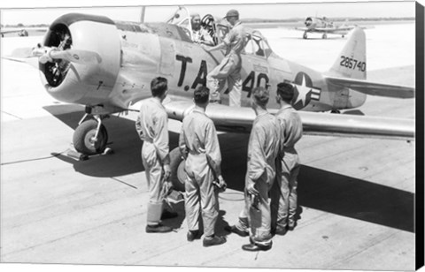 Framed Rear view of four soldiers standing near a fighter plane, T-6 Texan Print