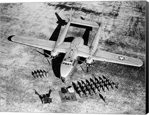 Framed High angle view of soldiers standing near a military airplane, Fairchild C-119 Flying Boxcar Print