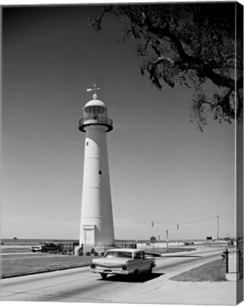 Framed USA, Mississippi, Biloxi, Biloxi Lighthouse with street in the foreground Print