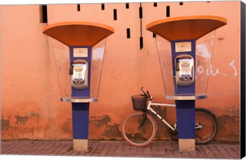 Framed Public telephone booths in front of a wall, Morocco Print