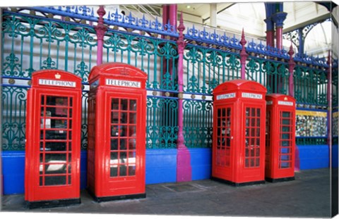 Framed Four telephone booths near a grille, London, England Print