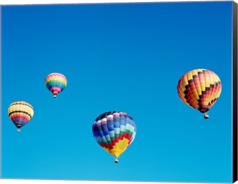 Framed 4 Rainbow Hot Air Balloons in the Bright Blue Sky Print