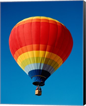 Framed Low angle view of a hot air balloon in the sky, New Mexico, Rainbow Print