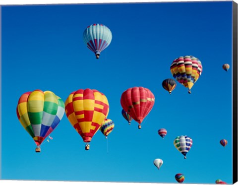 Framed Low angle view of a group of hot air balloons in the sky Print