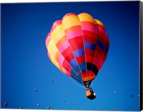 Framed Lone Hot Air Balloon with Other Hot Air Balloons in the Distance Print