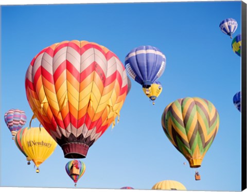 Framed Low angle view of hot air balloons in the sky Print