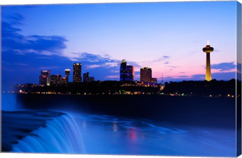 Framed Waterfall with buildings lit up at dusk, American Falls, Niagara Falls, City of Niagara Falls, New York State, USA Print