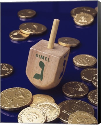 Framed Close-up of a Hanukkah dreidel with Hanukkah gelts Print