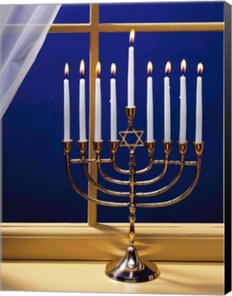 Framed Close-up of burning candles on a menorah at a window Print