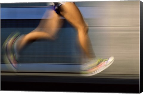 Framed Low section view of a person running on blue Print