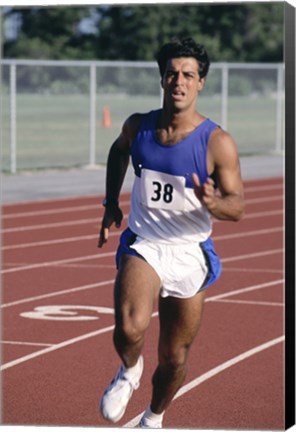 Framed Male athlete running on a running track Print