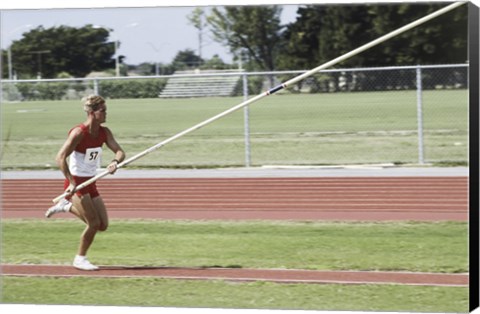 Framed Male athlete pole vaulting Print