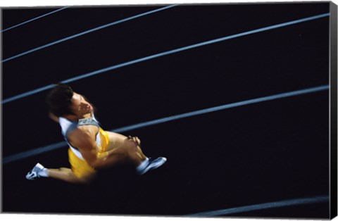 Framed High angle view of a young man running on a running track Print