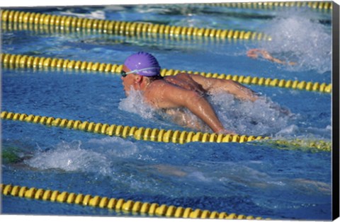 Framed Swimmer racing in a swimming pool Print