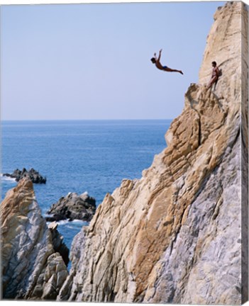 Framed Male cliff diver jumping off a cliff, La Quebrada, Acapulco, Mexico Print