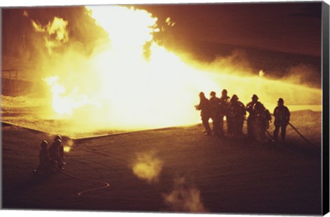 Framed High angle view of firefighters extinguishing a fire Print