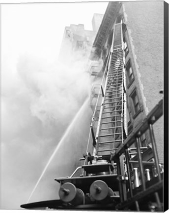 Framed Fire engine with ladder up burning building Print