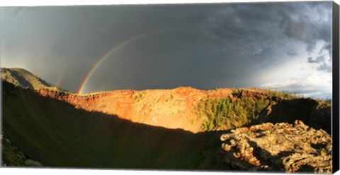 Framed Crater of an extinct volcano with a rainbow in the sky Print