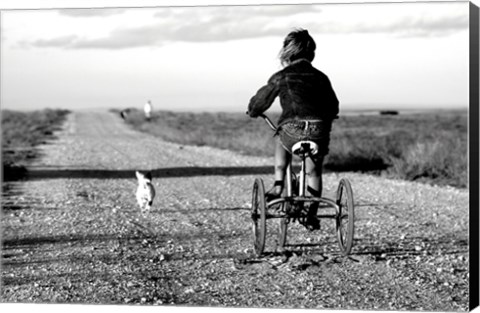 Framed Rear view of a girl riding a bicycle Print