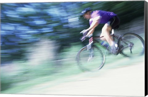 Framed Side profile of a young man riding a bicycle Print