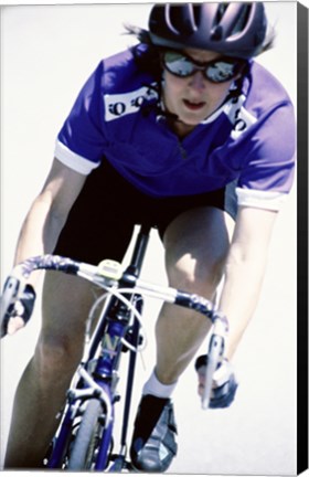 Framed Young woman riding a bicycle Print