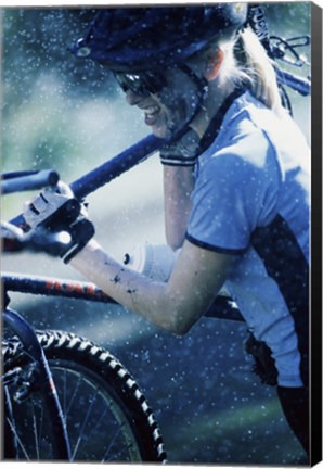 Framed Young woman carrying a bicycle on her shoulders Print